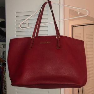 Red Michael Kors handbag